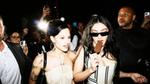 A girlfriend talks to Charli xcx as she walks along eating a classic milk chocolate Magnum ice cream