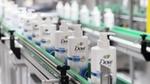 Dove pump action products on a factory production line enabled by AI for efficiency and productivity.