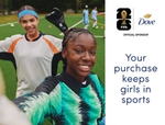 Two girls in football kit smiling, with accompanying messaging on how purchases of Dove limited editions can help keep girls playing.