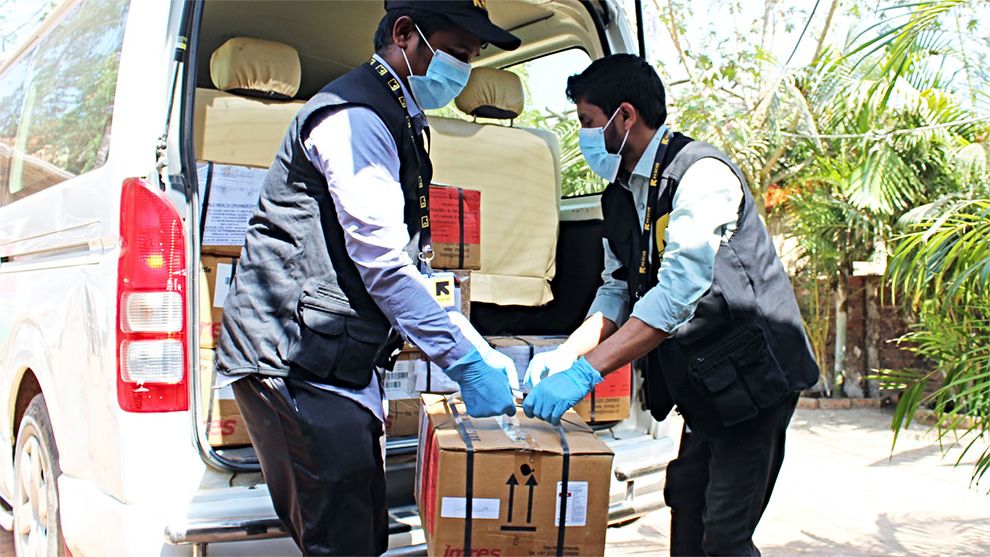 International Rescue Committee representatives unload a delivery at a refugee camp. CREDIT: International Rescue Committee