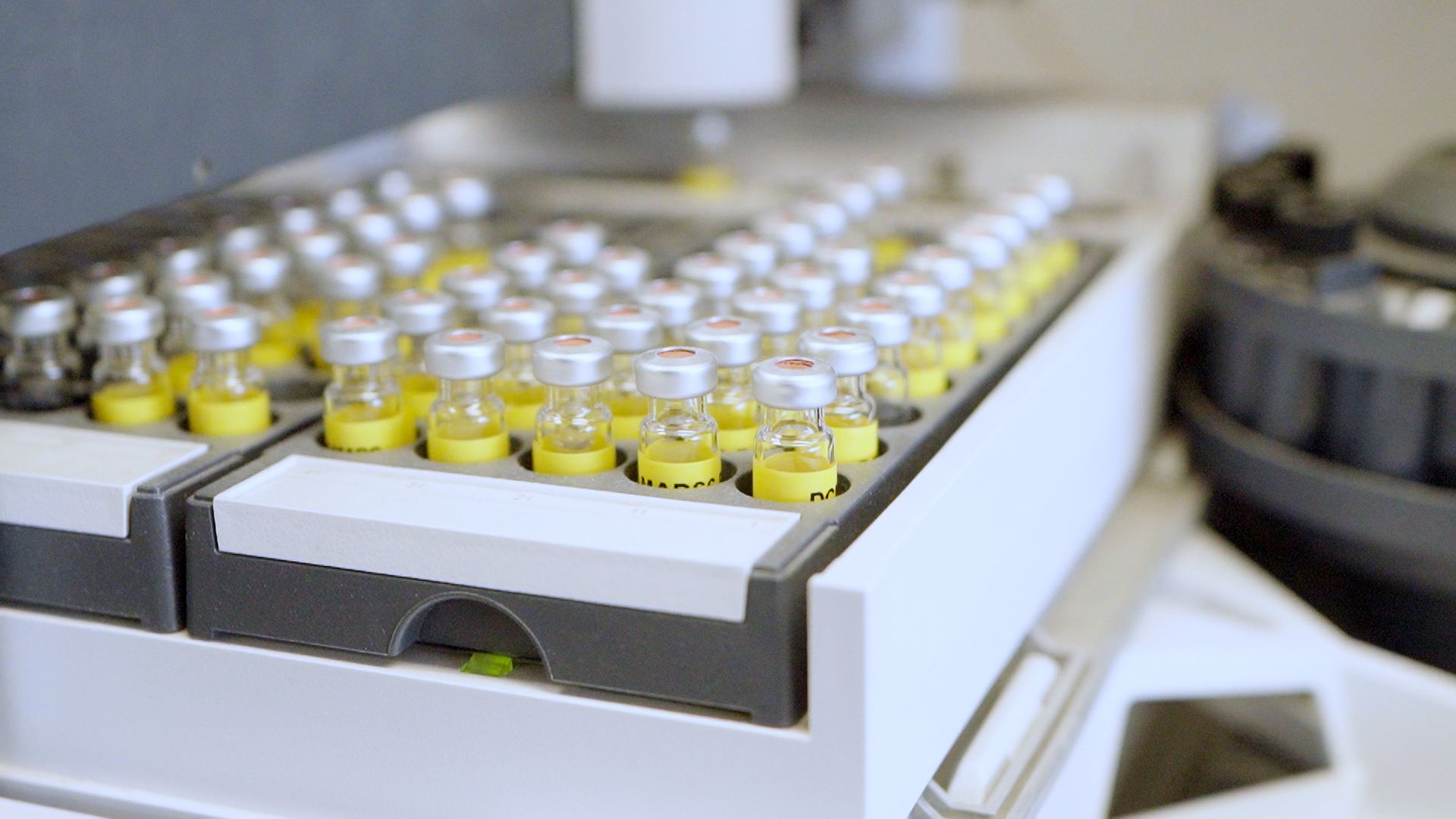 Clear glass chemical bottles containing Lnear alkylbenzene (LAB) made from renewable carbon