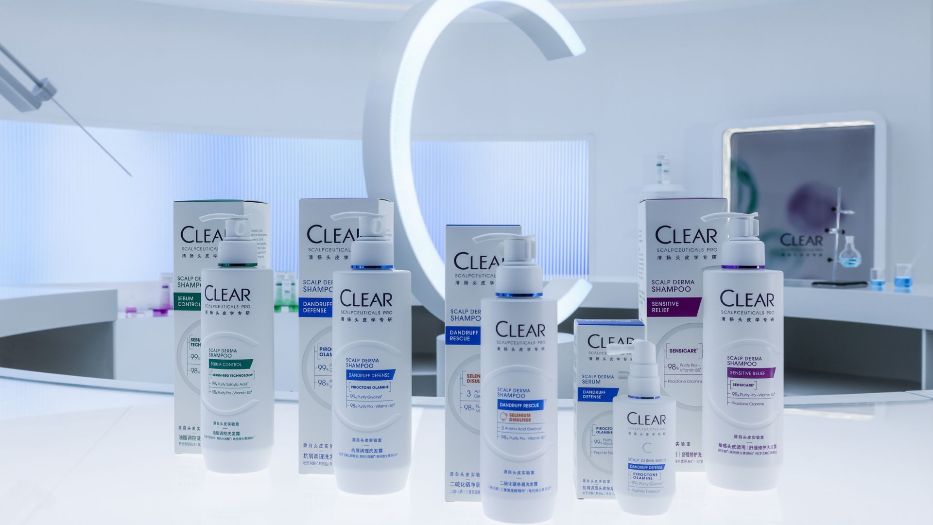 The full range of Clear’s ScalpCeutical’s bottles and packs on a white lab-style counter
