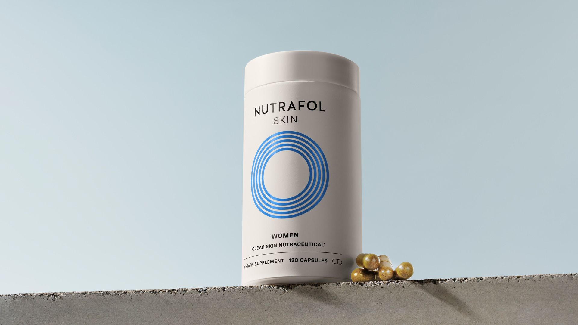 Bottle of Nutrafol Skin, a physician-formulated daily supplement for women designed to address the root causes of acne.