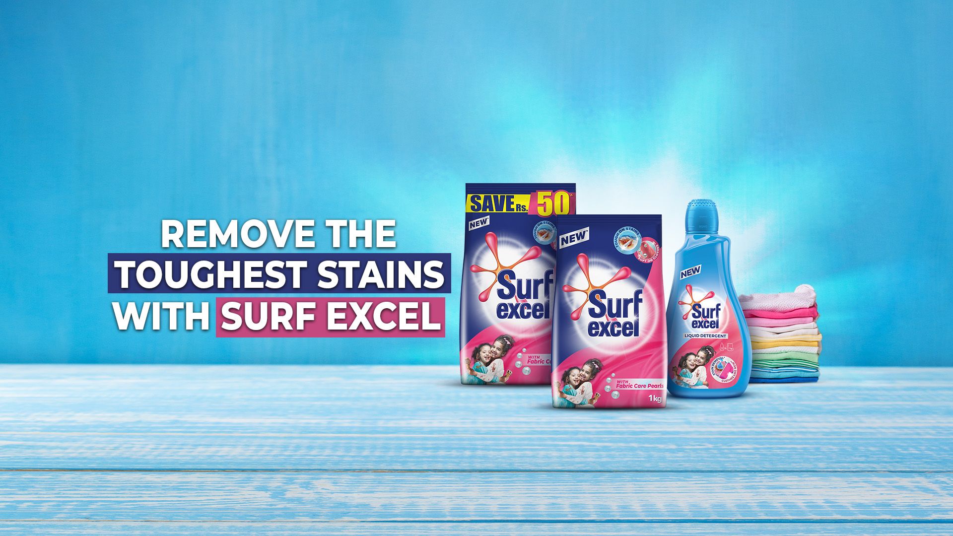 Three Surf Excel products, a pile of clean folded laundry, and a text that reads "Remove the toughest stains with Surf Excel".