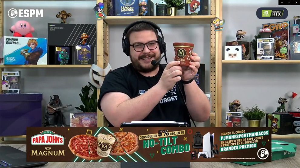 Gaming presenter holding up a Magnum ice cream pint during a live stream.