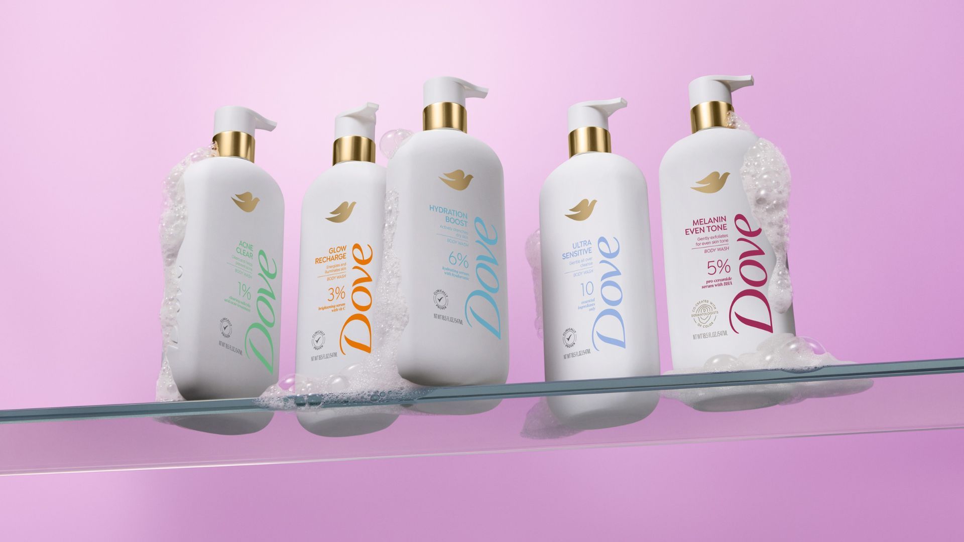 Shelf with five bottles of Dove’s new Serum Shower Collection of body washes, each designed to deliver skincare benefits