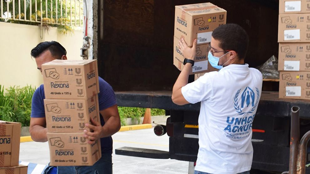 UNHCR representatives unloading boxes full of Unilever’s Rexona at a refugee camp