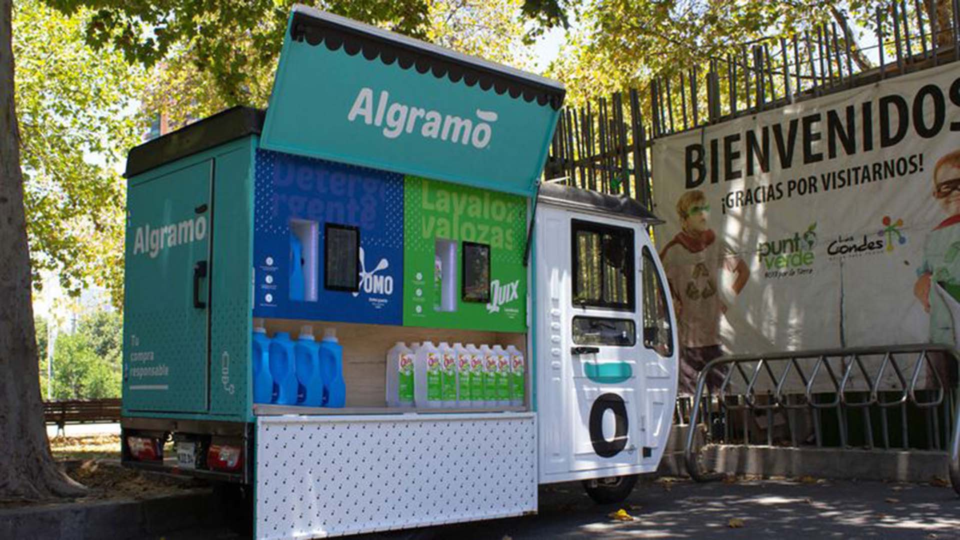 Algramo electric trike with dispensing machine that allows consumers to refill their OMO and Quix containers at home.