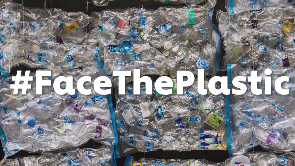 #FaceThePlastic written in front of plastics pile