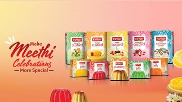 A collection of Rafhan custard, jelly, ice cream, and pudding boxes. The text on the left reads “Make Meethi Celebrations More Special”.