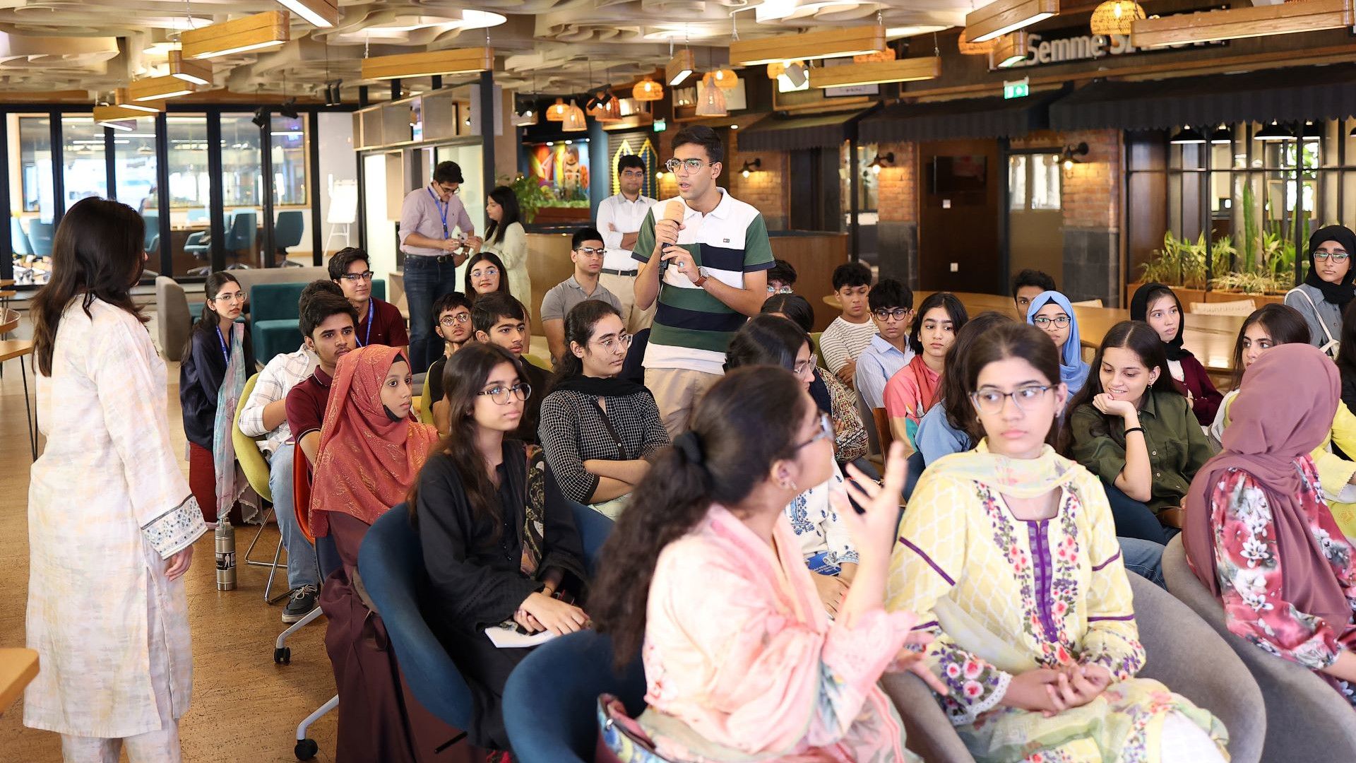 Kids attending a session and one of them is answering.