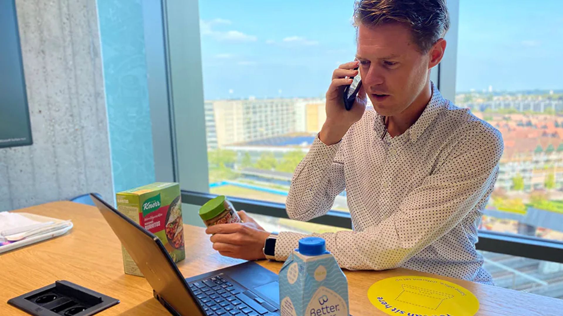 A man sitting at a computer inputting data