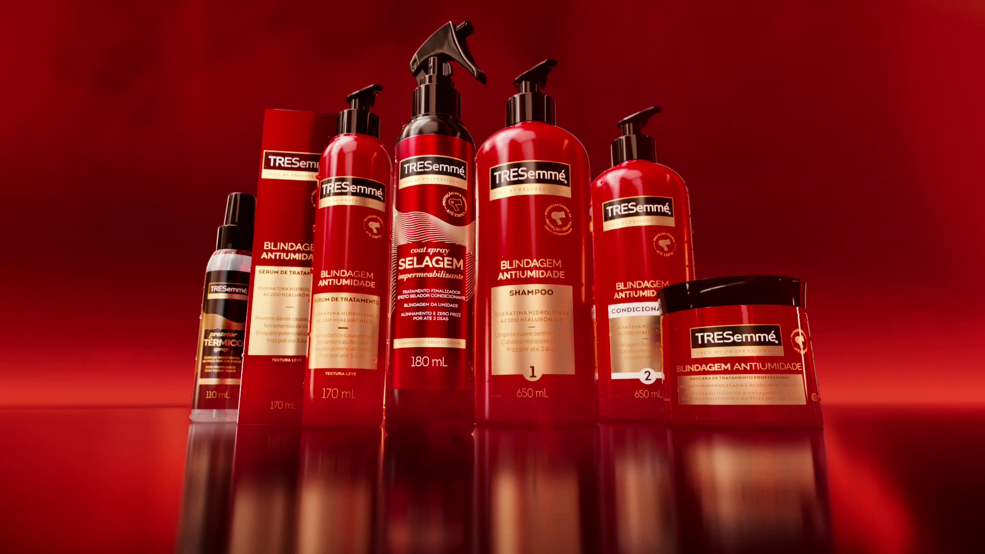 An image of red sprays, bottles and packs from Unilever’s TRESemmé hair care range, created using digital twin technology.