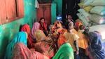 Women sit together watching an iPad as part of a local workshop